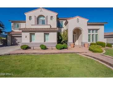 Two-story house with a landscaped front yard and walkway at 1912 E Gemini Pl, Chandler, AZ 85249
