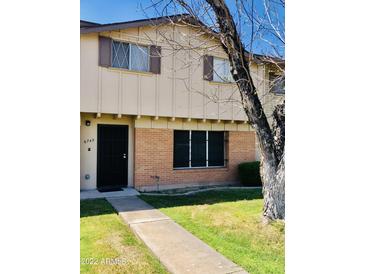 Brick two-story townhome with a private entrance and yard at 6742 N 43Rd Ave, Glendale, AZ 85301