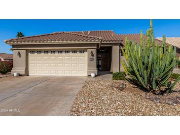 House exterior with a two-car garage at 14766 W Piccadilly Rd, Goodyear, AZ 85395