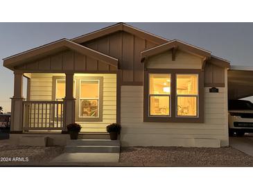 Charming craftsman style exterior, welcoming front porch and well manicured landscaping at 9302 E Broadway. -- # 147, Mesa, AZ 85208