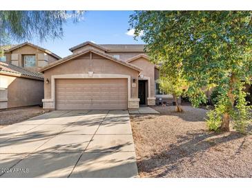 Two-story house with a two-car garage and a landscaped front yard at 3813 E Sierrita Rd, San Tan Valley, AZ 85143