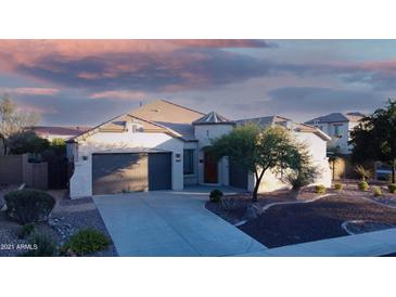 Attractive single-story home with a two-car garage at 42715 N Courage Trl, Anthem, AZ 85086