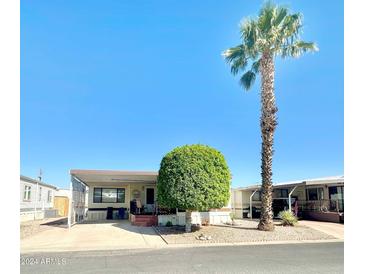 Single-wide manufactured home with carport at 8865 E Baseline Rd # 504, Mesa, AZ 85209