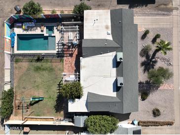 Aerial view showing house, pool, backyard, and playground at 3413 N 16Th N Dr, Phoenix, AZ 85015