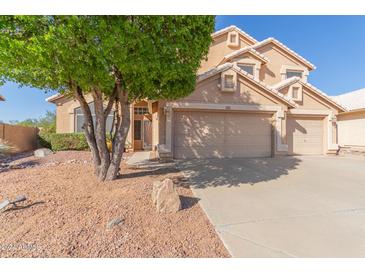 Two-story house with three-car garage and desert landscaping at 4356 E Rancho Tierra Dr, Cave Creek, AZ 85331
