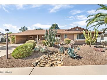 Attractive curb appeal with xeriscaping and desert plants at 10820 N Balboa Dr, Sun City, AZ 85351