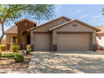 Two-story home with a two-car garage and desert landscaping at 2581 W Shackleton Dr, Anthem, AZ 85086