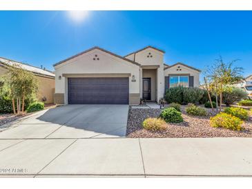 Charming single-story home with landscaped front yard at 8543 W Candlewood Way, Florence, AZ 85132