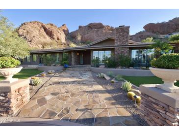 Stunning home exterior with mountain views and stone walkway at 5123 E Mcdonald Dr, Paradise Valley, AZ 85253