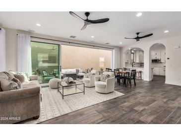 Open floor plan living area with sliding doors to a patio at 2947 N Sonoran Hls, Mesa, AZ 85207