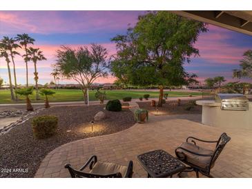 Relaxing patio with seating area and stunning sunset views at 2606 N 159Th Dr, Goodyear, AZ 85395