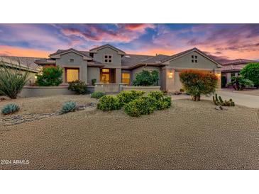 Single-story home exterior with desert landscaping at 19562 N Wikieup Ct, Surprise, AZ 85374