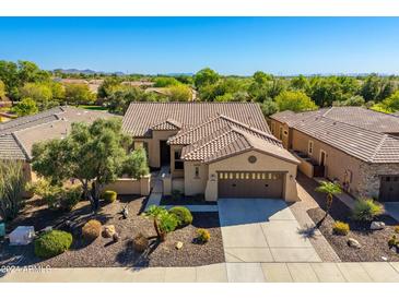 Single story home with tile roof and two car garage at 27789 N 129Th Ln, Peoria, AZ 85383