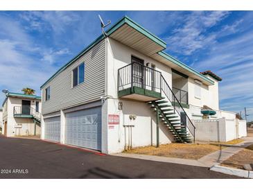 Two-story building with attached garage and external staircase at 2132 W Glenrosa Ave # 81D, Phoenix, AZ 85015