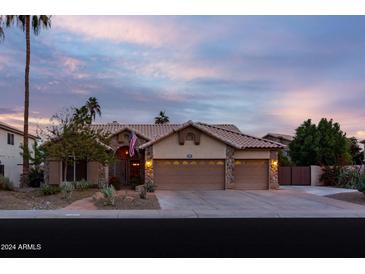 Beautiful desert home with landscaped front yard, two-car garage, and welcoming entryway at 851 N Pineview Dr, Chandler, AZ 85226