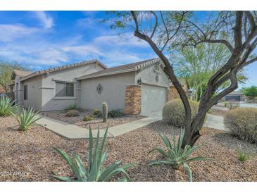 View of the home's exterior, landscaping, and walkway at 40315 N Bell Meadow Trl, Phoenix, AZ 85086