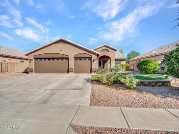 Charming single story home with a spacious driveway and landscaping at 916 E Beautiful Ln, Phoenix, AZ 85042