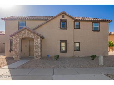 Two-story home with stone accents and a welcoming entrance at 817 E Agua Fria Ln, Avondale, AZ 85323