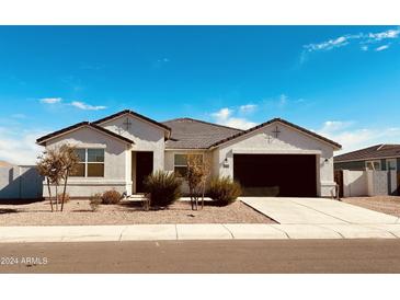 Immaculately kept home with a two-car garage and desert landscaping at 18195 N San Juan St, Maricopa, AZ 85138