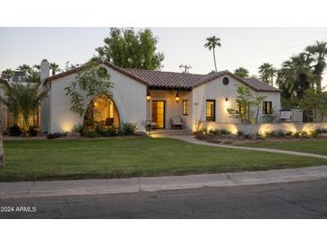 Stunning Spanish-style home exterior, well-maintained landscaping, and a welcoming entrance at 1817 Palmcroft Ne Way, Phoenix, AZ 85007