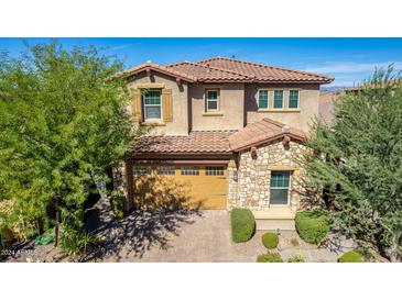 Two-story house with stone accents and a three-car garage at 4526 E Vista Bonita Dr, Phoenix, AZ 85050