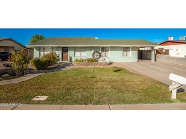 Charming ranch home with well-maintained lawn and landscaping at 738 E Gable Ave, Mesa, AZ 85204