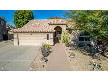 Single-story home with tile roof, landscaped yard, and two-car garage at 491 W Courtney Ln, Tempe, AZ 85284