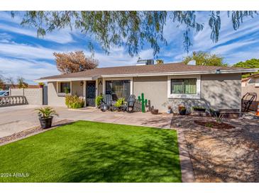 Cute ranch home with a landscaped front yard at 926 W Piedmont Rd, Phoenix, AZ 85041