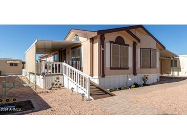 Charming single-wide manufactured home with covered porch and landscaping at 2650 W Union Hills Dr # 344, Phoenix, AZ 85027