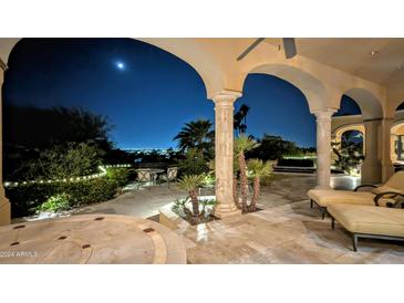 Elegant patio with city views, comfortable lounge chairs, and a dining area at 4836 E White Gates Dr, Phoenix, AZ 85018