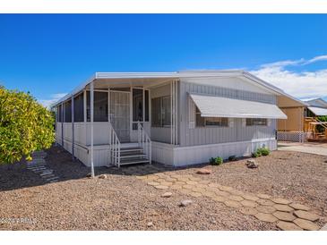 Nice manufactured home with covered porch and landscaping at 2650 W Union Hills Dr # 258, Phoenix, AZ 85027