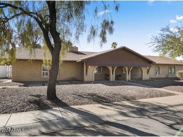 Ranch-style home with mature landscaping and large driveway at 1009 E Shadow Ridge Rd # 1, Casa Grande, AZ 85122