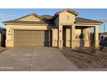 One-story home with attached garage and desert landscaping at 5007 S 105Th Dr, Tolleson, AZ 85353