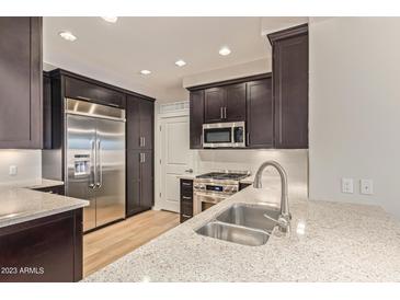 Modern kitchen with stainless steel appliances at 4803 N Woodmere Fairway -- # 2006, Scottsdale, AZ 85251