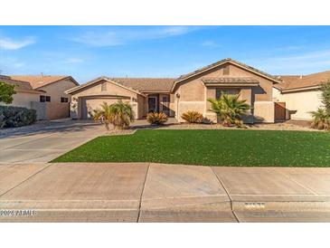 Single-story home with a landscaped lawn and two-car garage at 3514 E Parkview Dr, Gilbert, AZ 85295