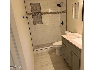 Updated bathroom with subway tile shower and vanity at 2721 W Luke Ave, Phoenix, AZ 85017