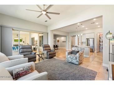 Open living room with view into the kitchen area at 16944 W Coronado Rd, Goodyear, AZ 85395
