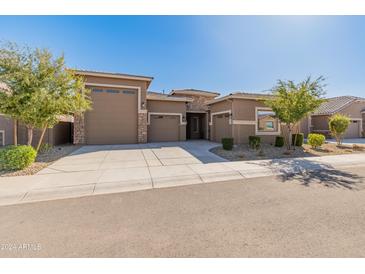 Two-car garage and charming curb appeal at 24741 N 175Th Dr, Surprise, AZ 85387