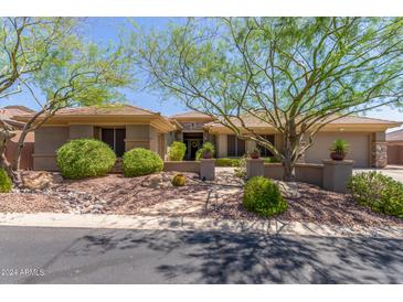 Beautiful home exterior with landscaping and desert accents at 41619 N River Bend Rd, Anthem, AZ 85086