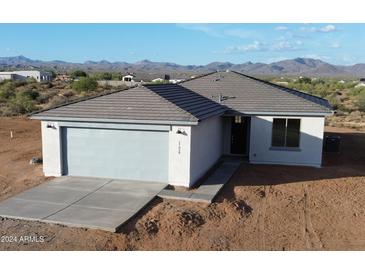 Single story home with a two car garage and mountain views at 58Xx N Nigal Rd, Casa Grande, AZ 85194