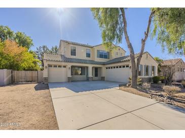 Two-story home with a three-car garage and mature trees at 3795 E Latham Ct, Gilbert, AZ 85297