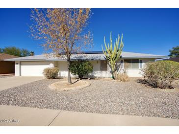 Ranch style home with gravel landscaping and cacti at 16025 N Nicklaus Ln, Sun City, AZ 85351