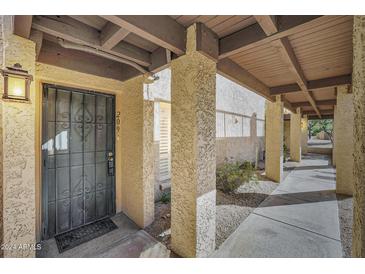 Private entryway with covered walkway leading to the front door at 7402 E Carefree Dr # 209, Carefree, AZ 85377