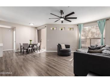 Spacious living room featuring hardwood floors and ample natural light at 9550 E Thunderbird Rd # 155, Scottsdale, AZ 85260