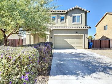 Two-story house with a two-car garage and landscaped front yard at 5414 S 10Th Ave, Phoenix, AZ 85041