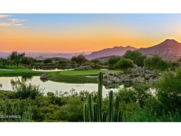 Scenic aerial view of golf course community at sunset at 10755 E Stoney Ln, Scottsdale, AZ 85262