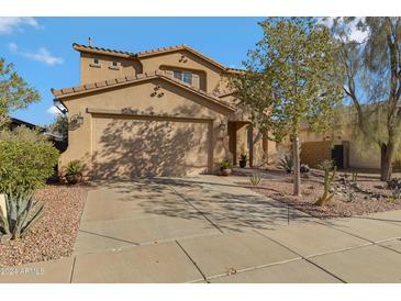 Two story home with desert landscaping and two car garage at 26853 N 176Th Dr, Surprise, AZ 85387