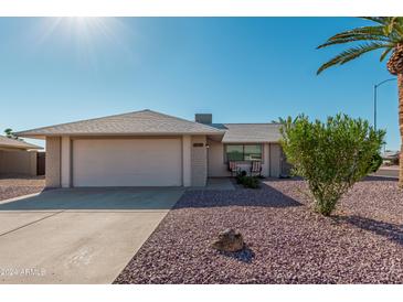 Ranch style home with a two-car garage and desert landscaping at 12739 W Beechwood Dr, Sun City West, AZ 85375