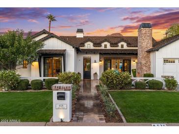 Stunning farmhouse exterior with brick and white accents at 4526 E Calle Tuberia --, Phoenix, AZ 85018