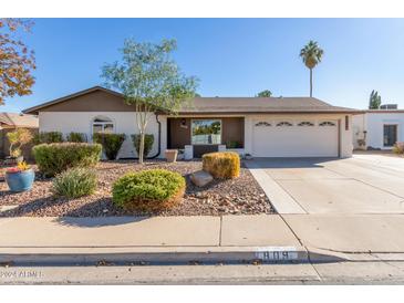 Single-story home with a two-car garage and well-manicured landscaping at 809 W Lindner Ave, Mesa, AZ 85210